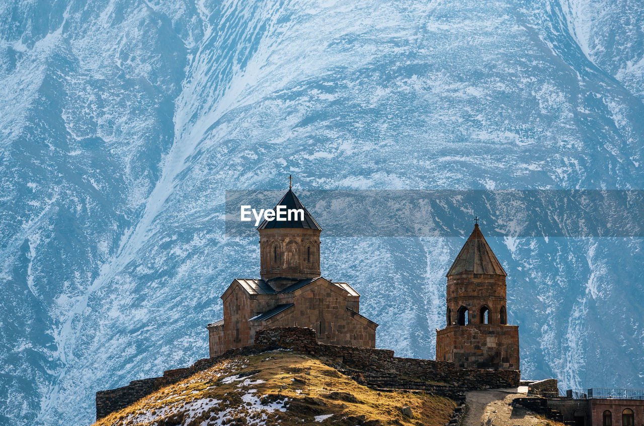 Church against snow covered mountains