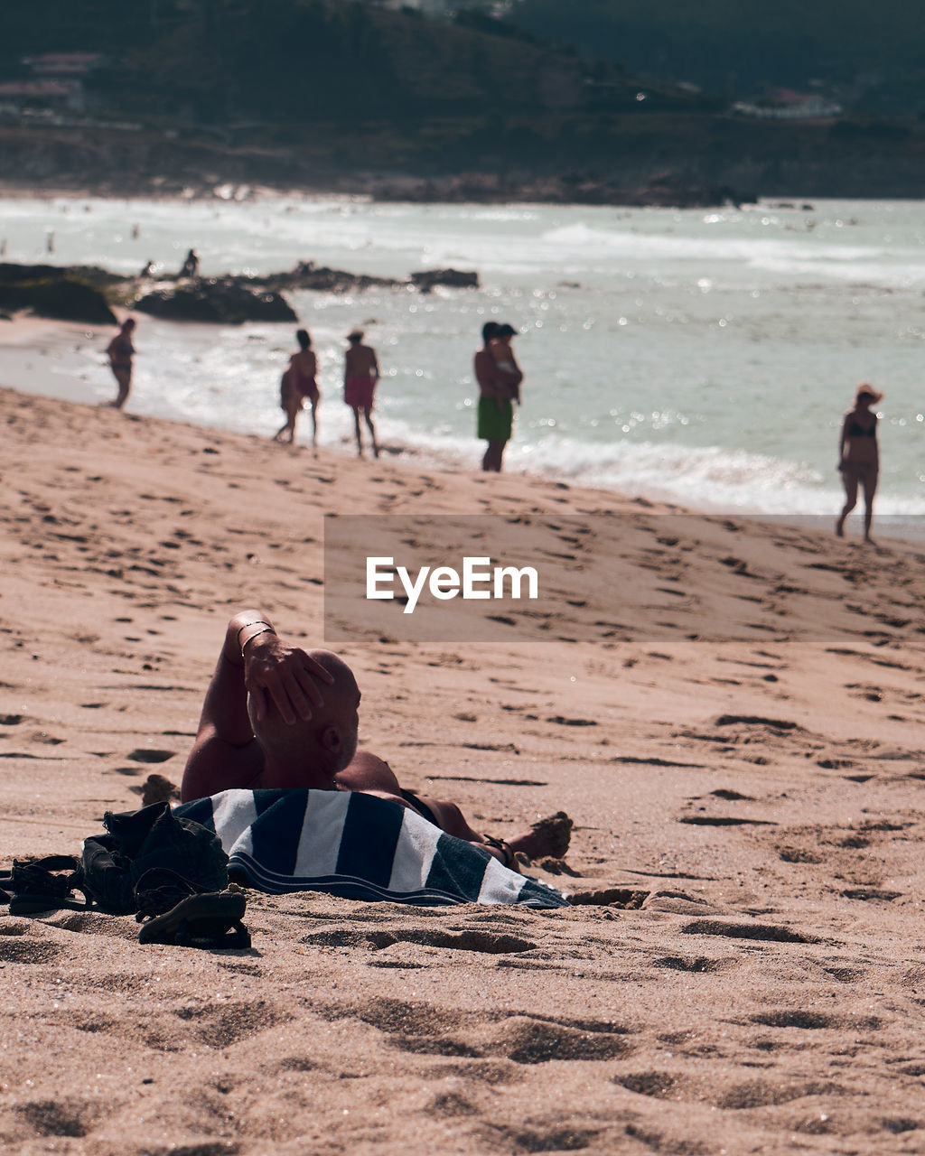 GROUP OF PEOPLE ON BEACH