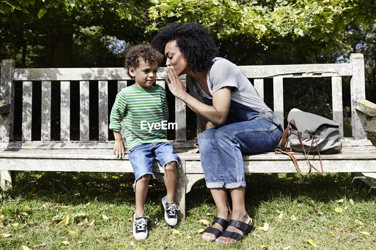Mother and son on bench