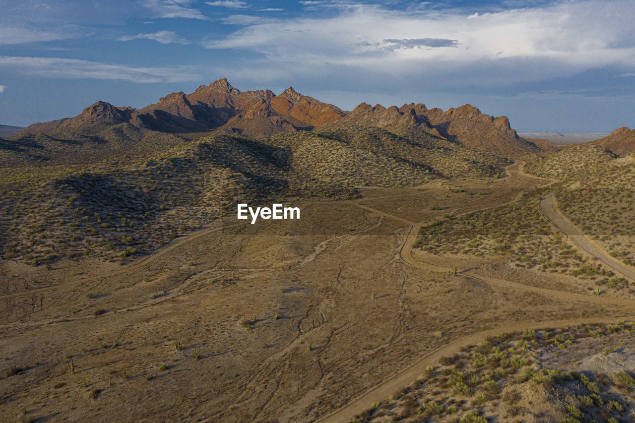 Scenic view of rocky mountains against sky