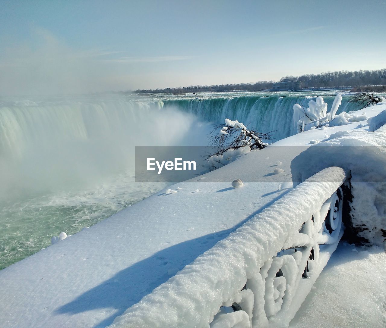 Scenic view of frozen lake against sky during winter