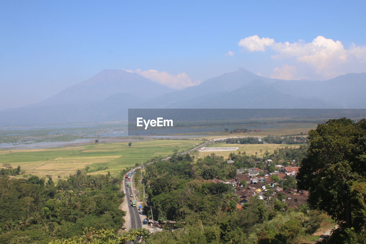 Scenic view of landscape and mountains against sky