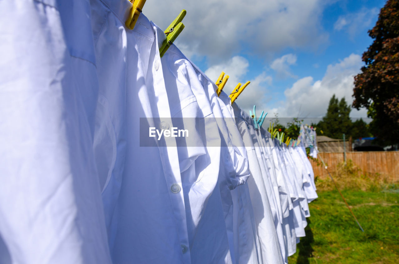 PANORAMIC SHOT OF CLOTHES DRYING ON CLOTHESLINE