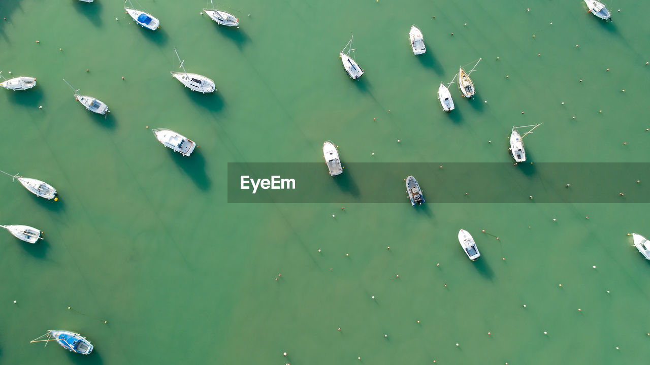 HIGH ANGLE VIEW OF FLOATING IN WATER