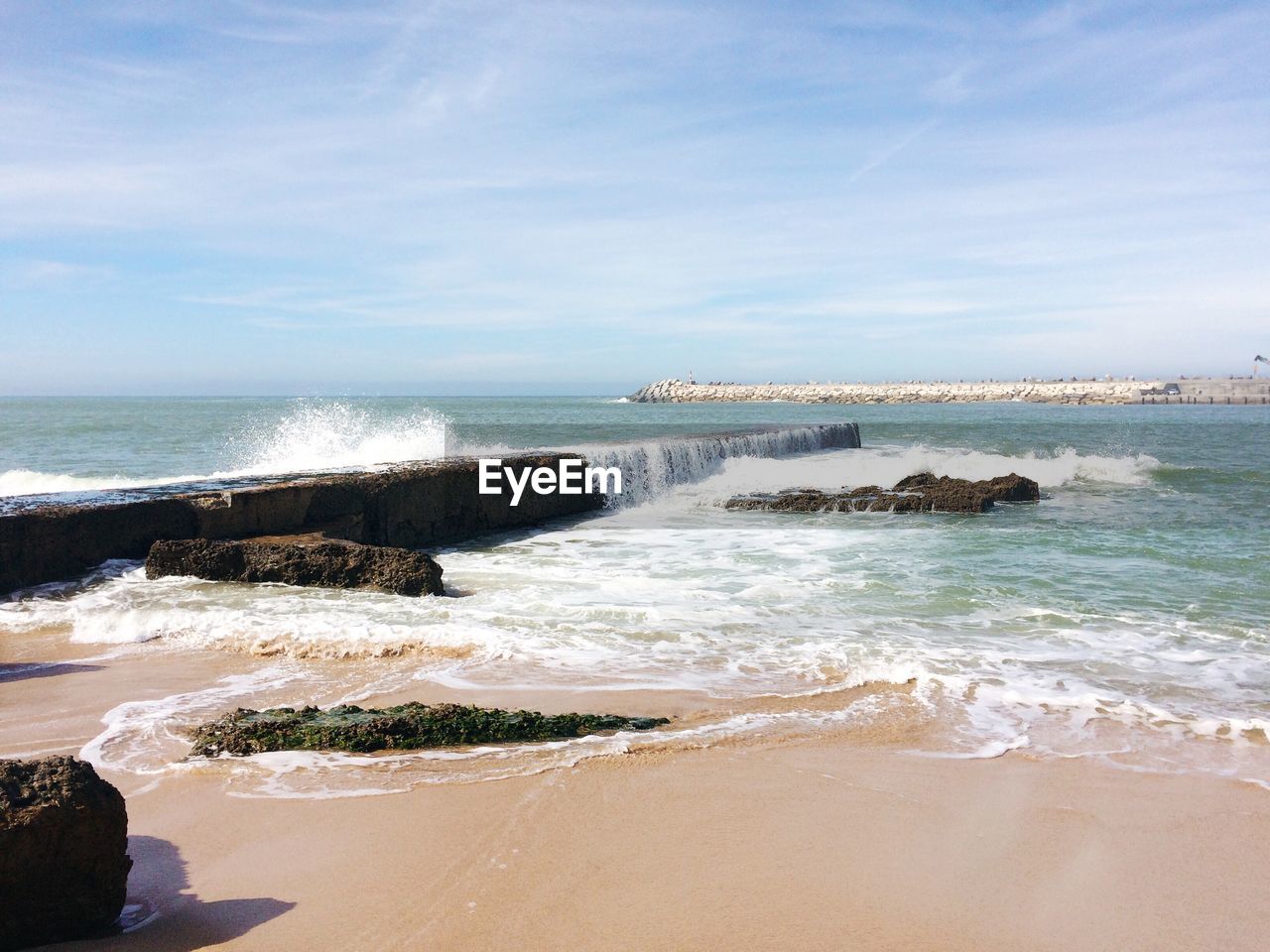 Scenic view of beach against sky