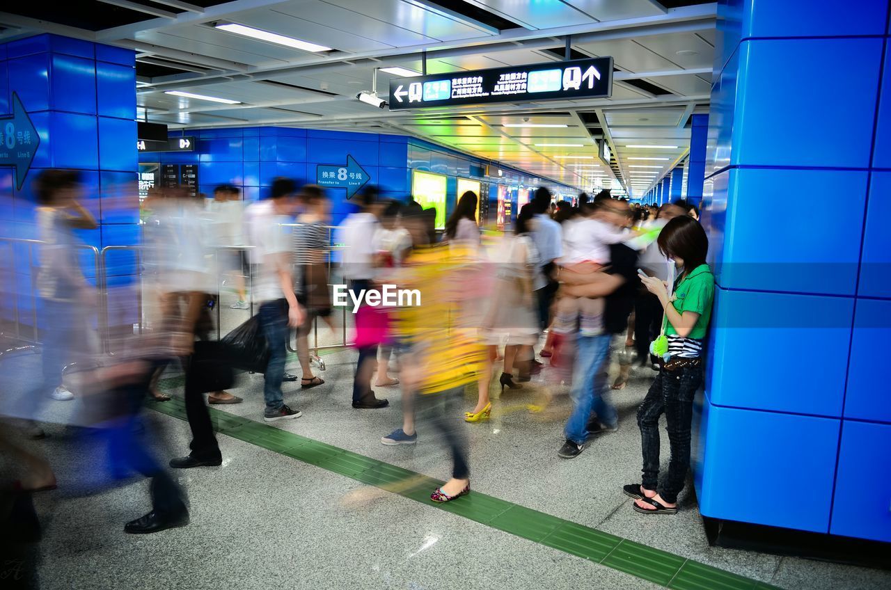 Blur image of crowd in railroad station