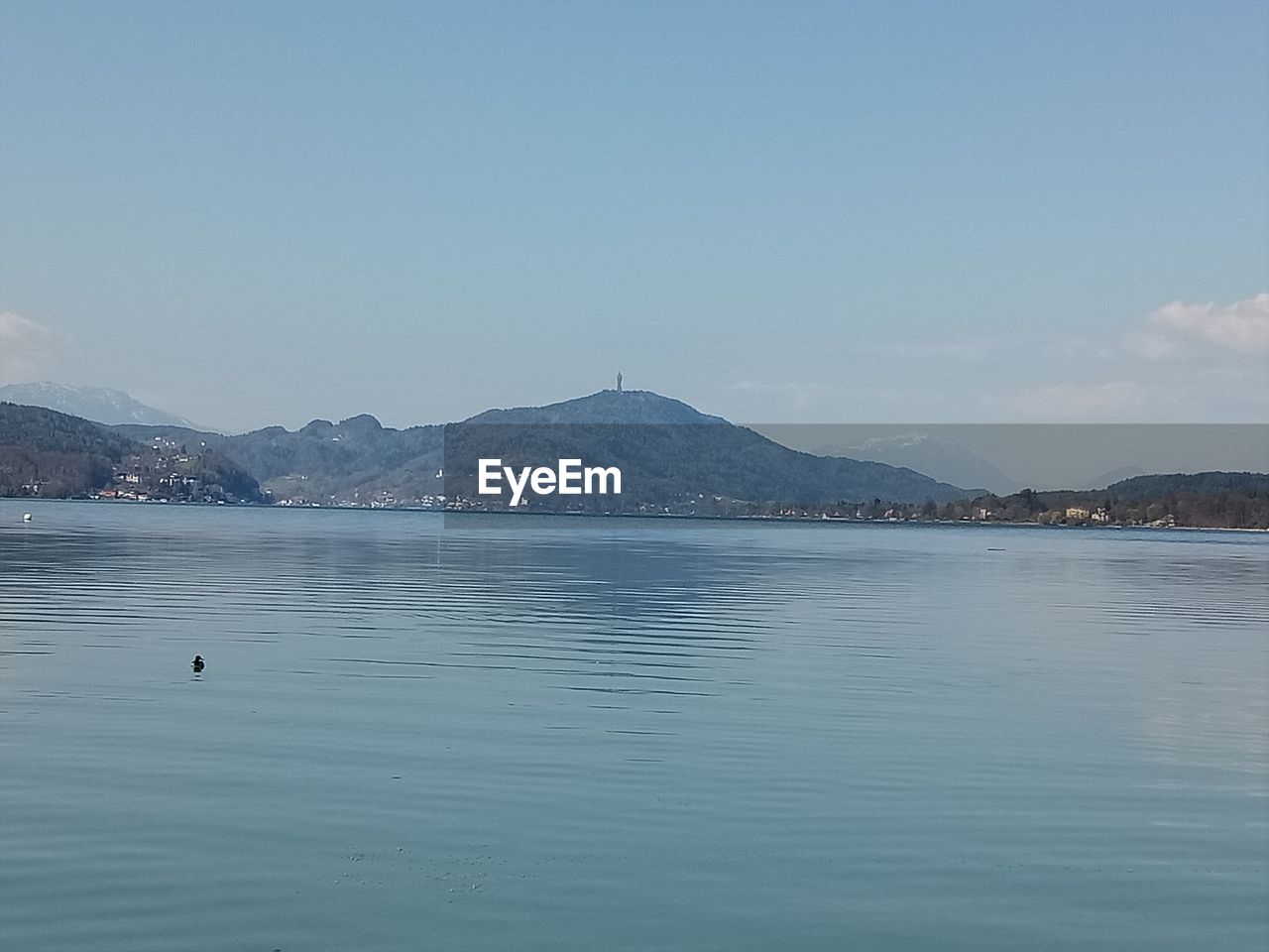 SCENIC VIEW OF SEA BY MOUNTAIN AGAINST SKY