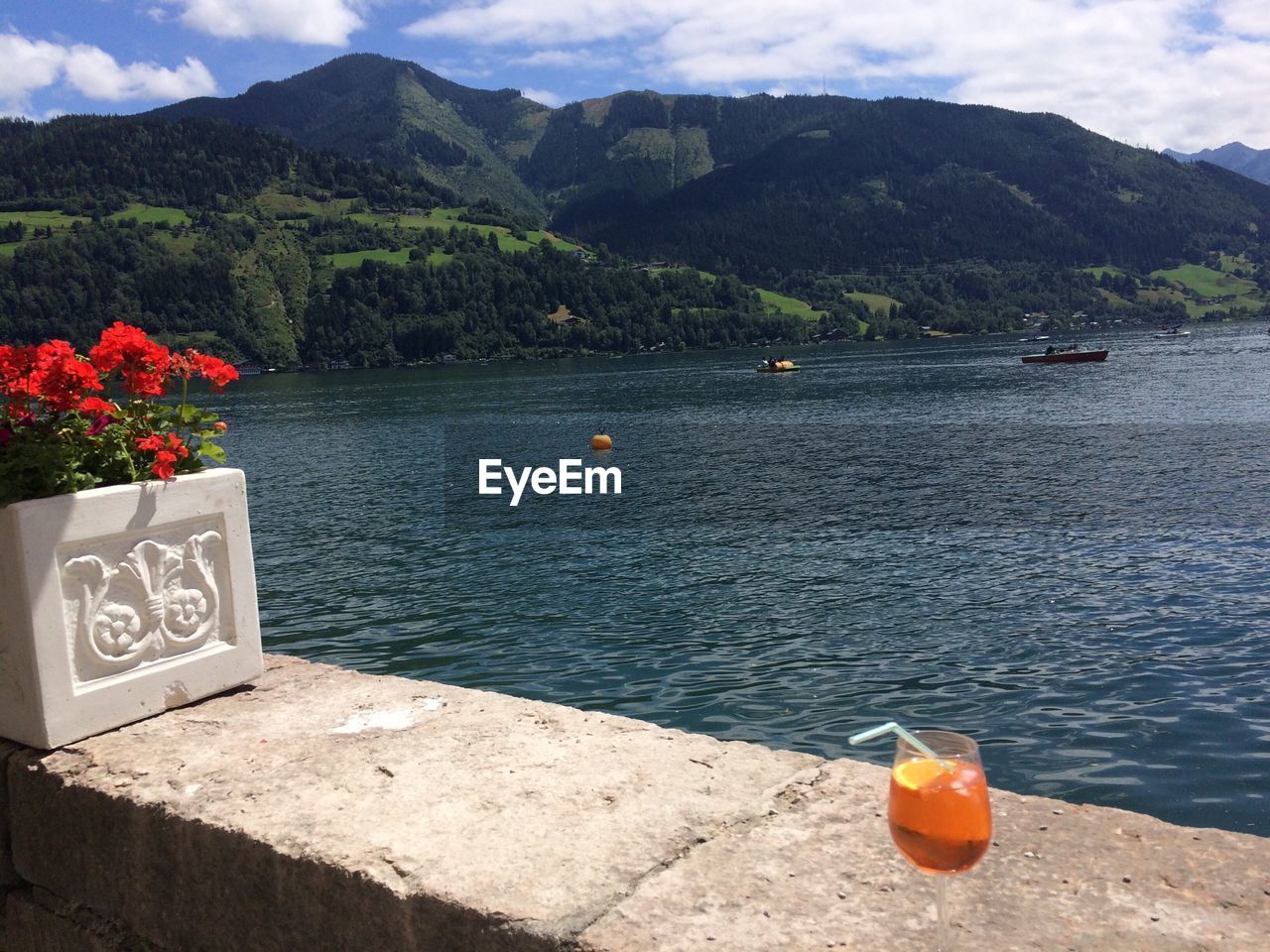 SCENIC VIEW OF LAKE WITH MOUNTAINS IN BACKGROUND