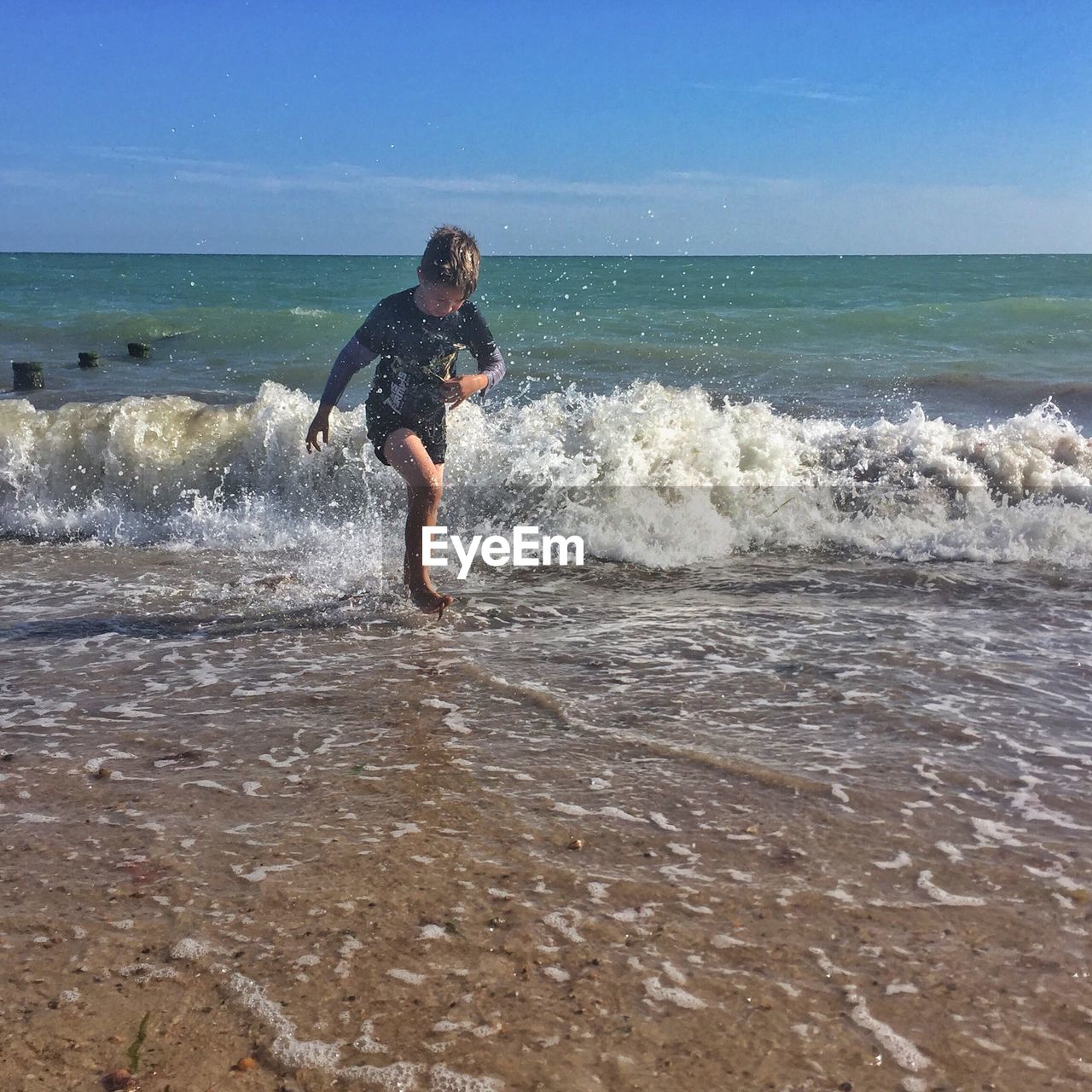 WOMAN ENJOYING AT BEACH