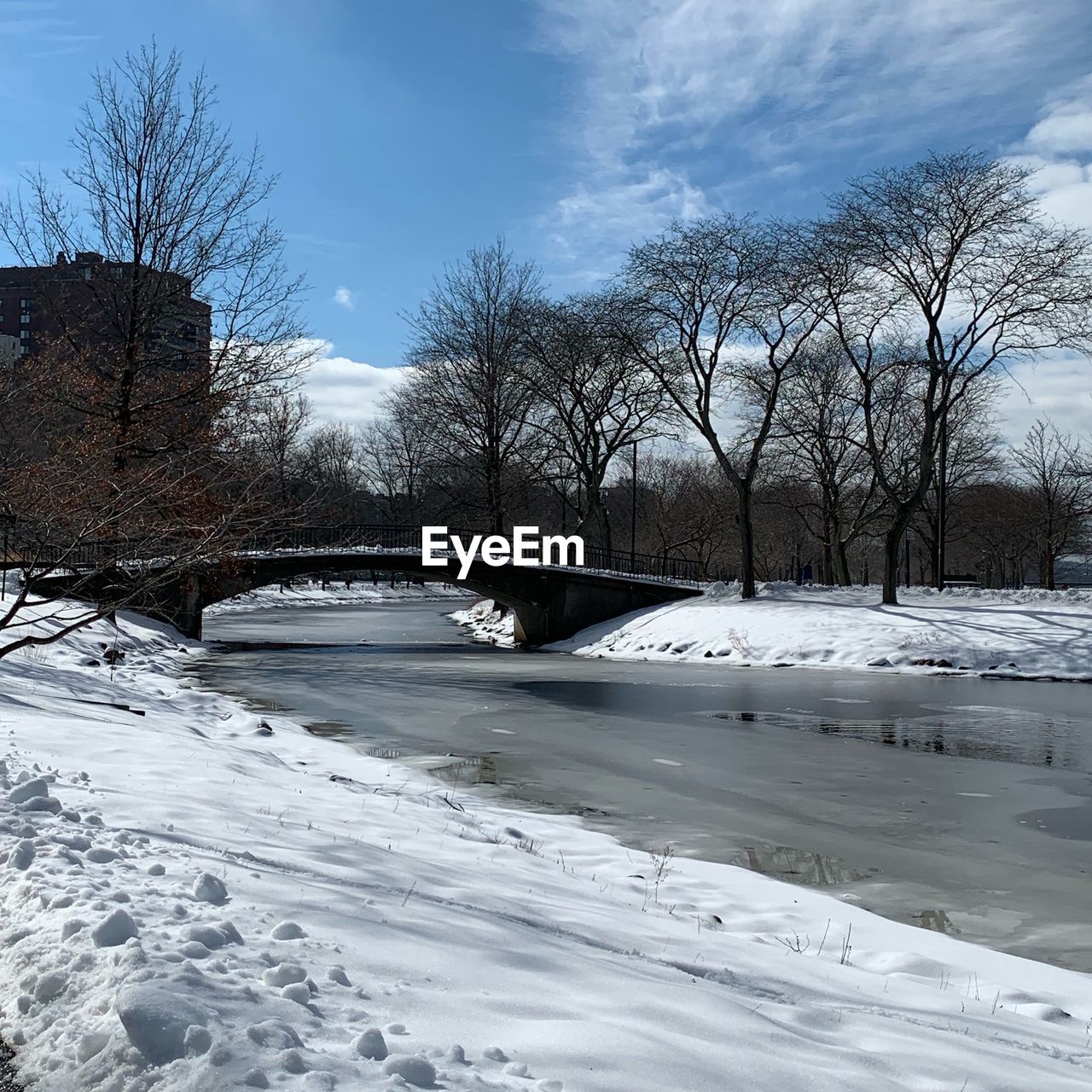 BRIDGE OVER RIVER DURING WINTER