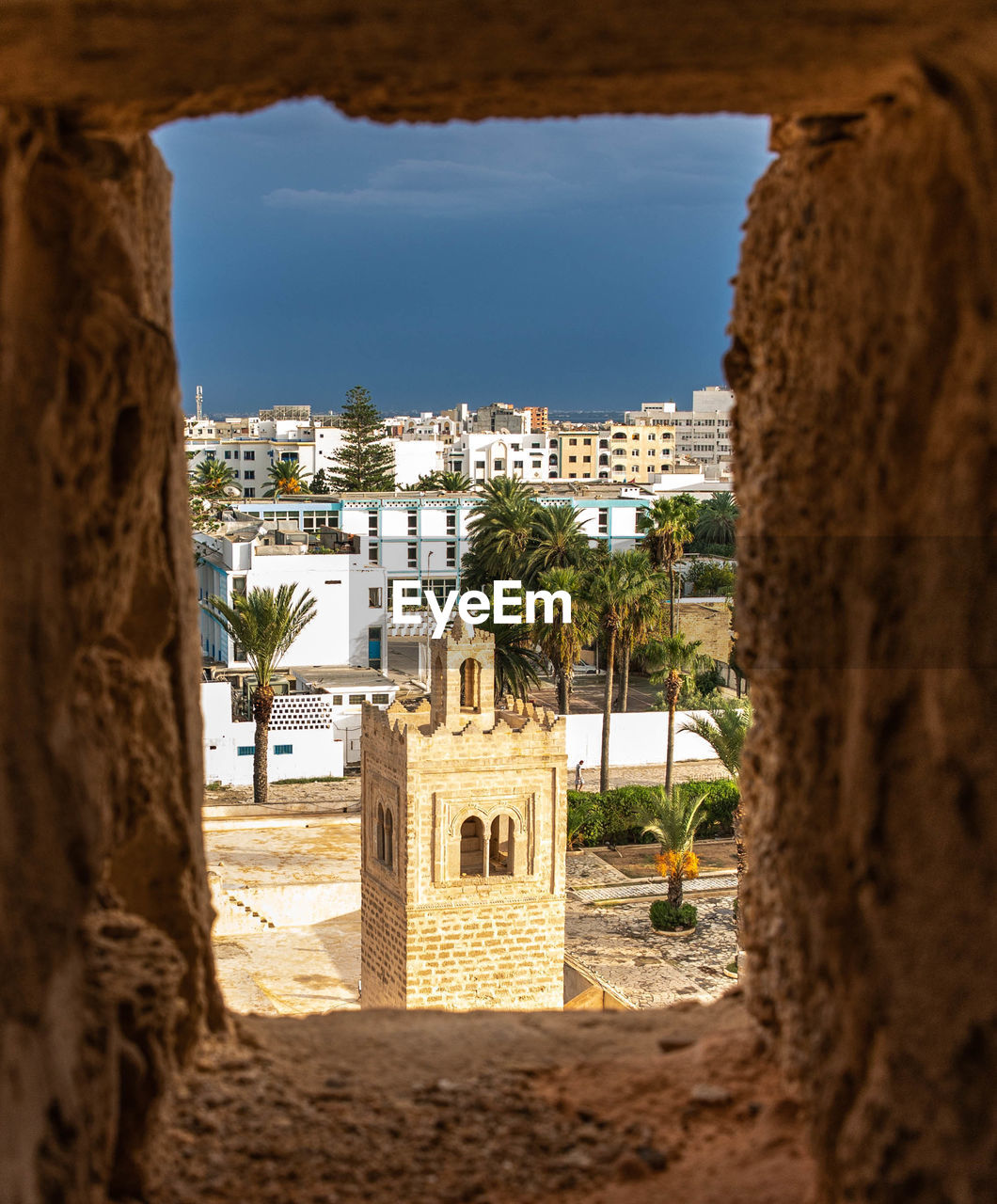 BUILDINGS SEEN THROUGH OLD WINDOW