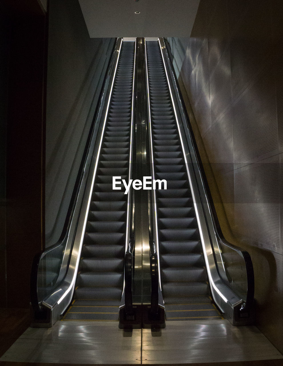 HIGH ANGLE VIEW OF ESCALATOR IN UNDERGROUND