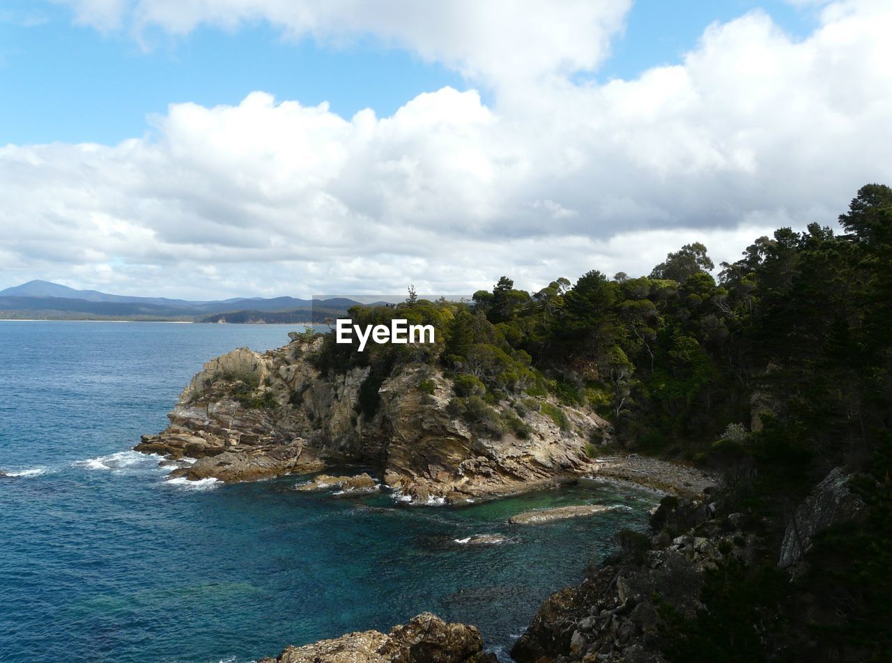 Scenic view of sea against cloudy sky