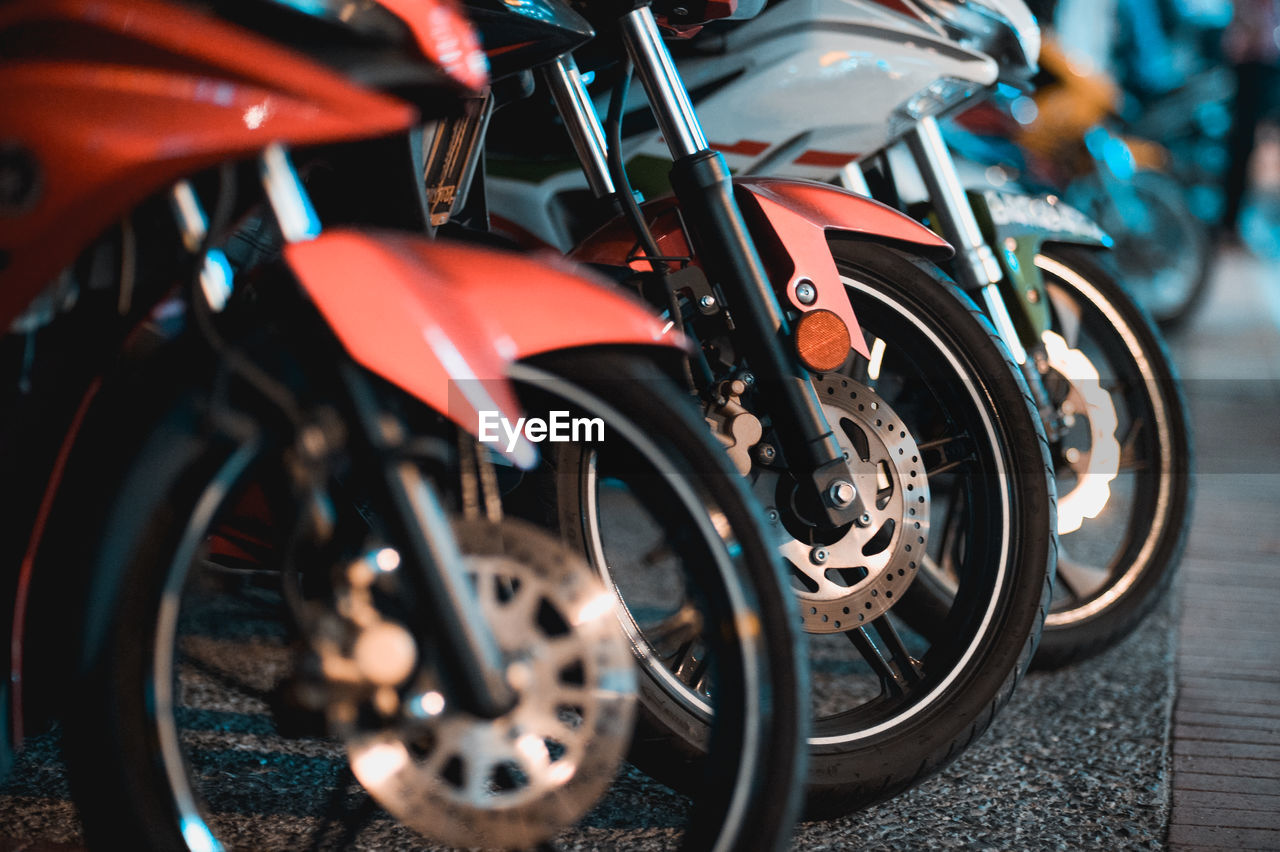 Close-up of toy motorcycles on street