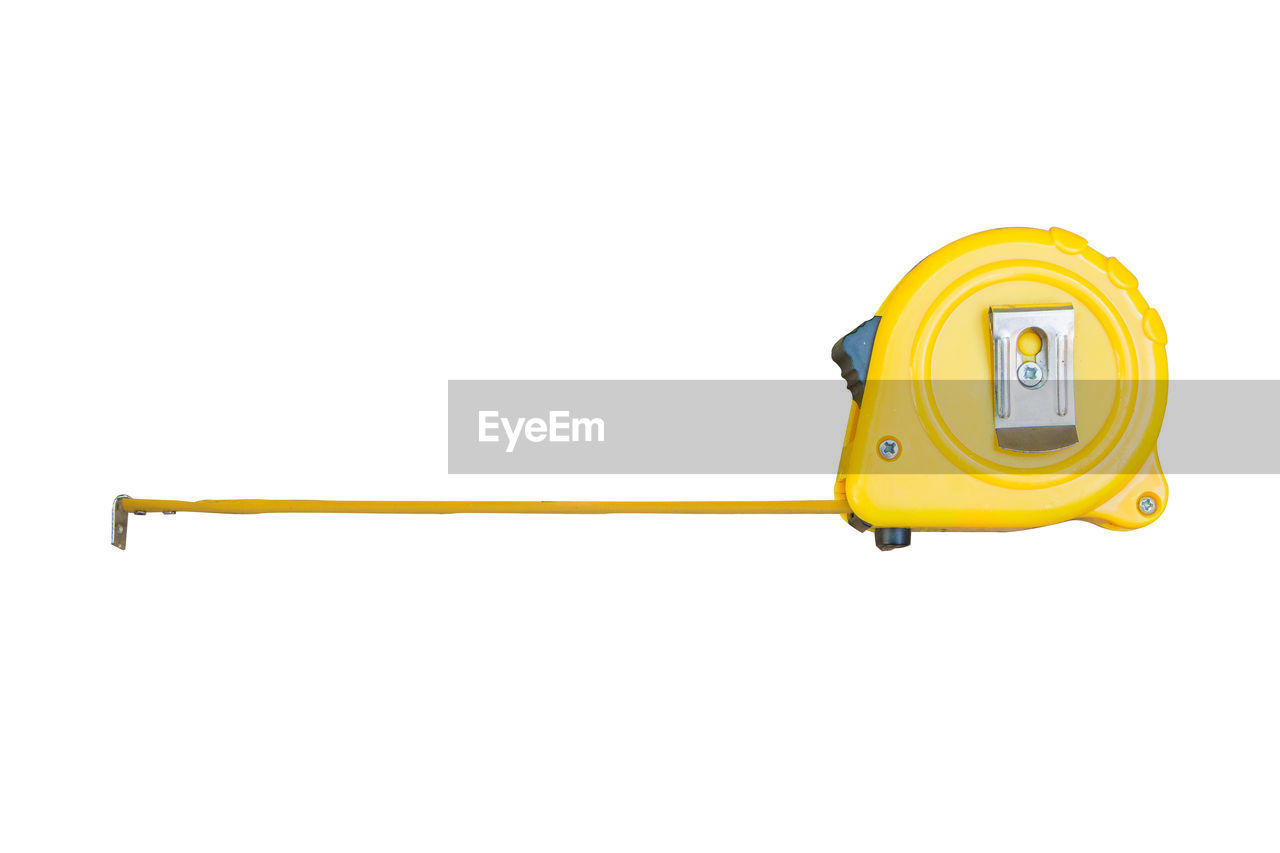 Close-up of tape measure against white background