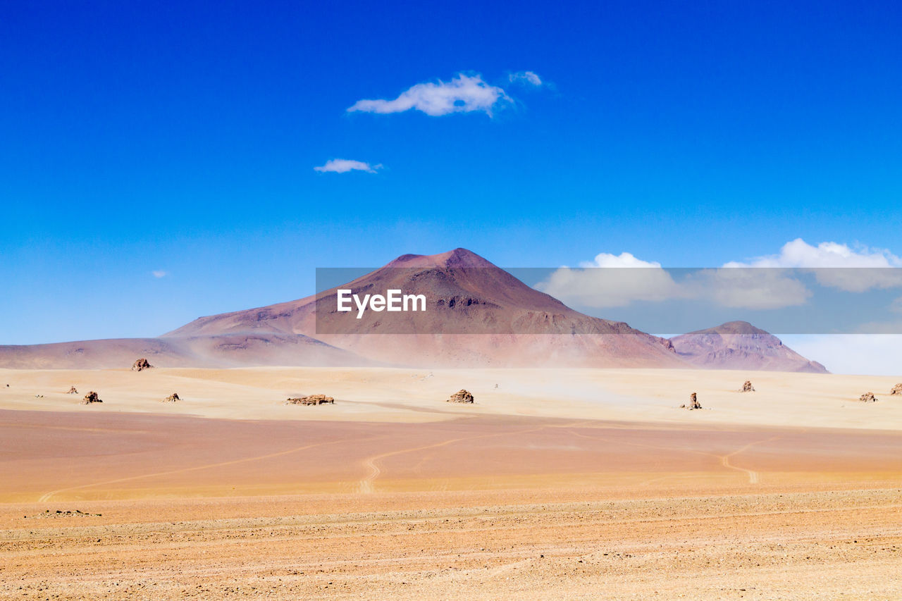 SCENIC VIEW OF ARID LANDSCAPE AGAINST SKY