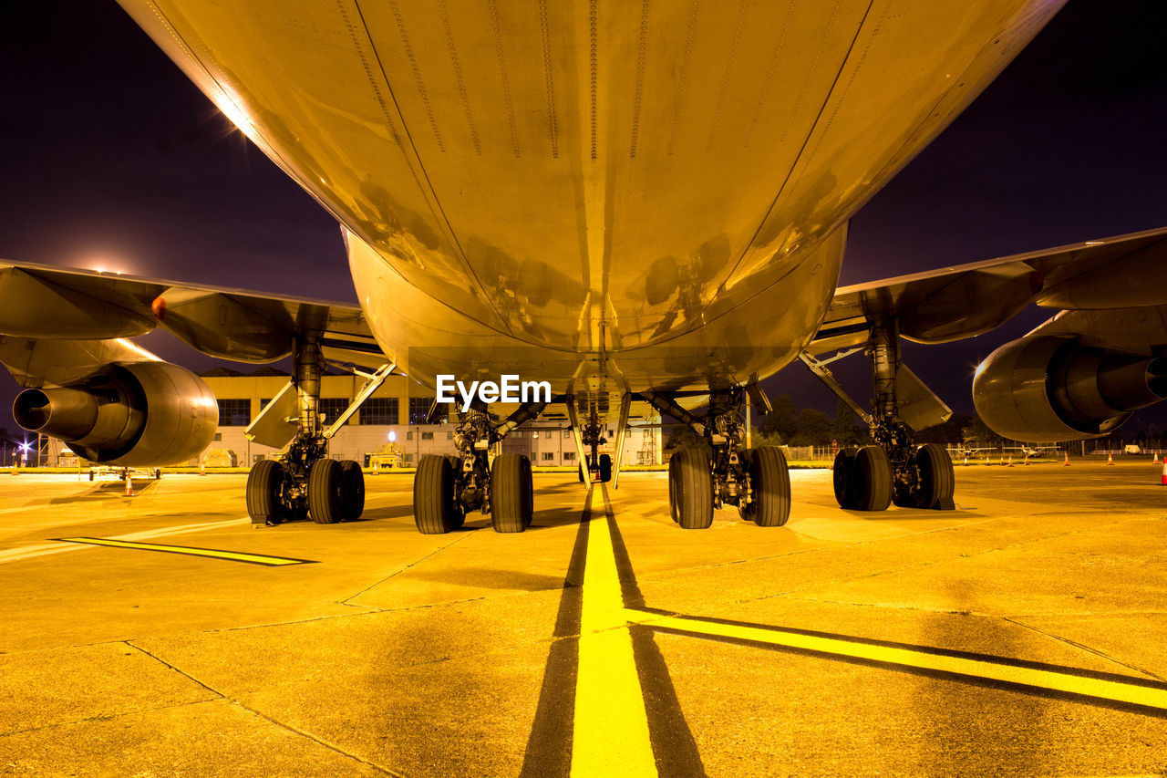 VIEW OF AIRPORT RUNWAY AT NIGHT