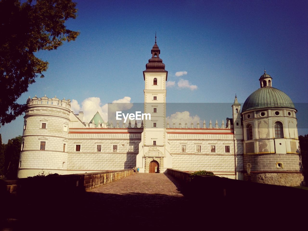 View of palace against cloudy sky