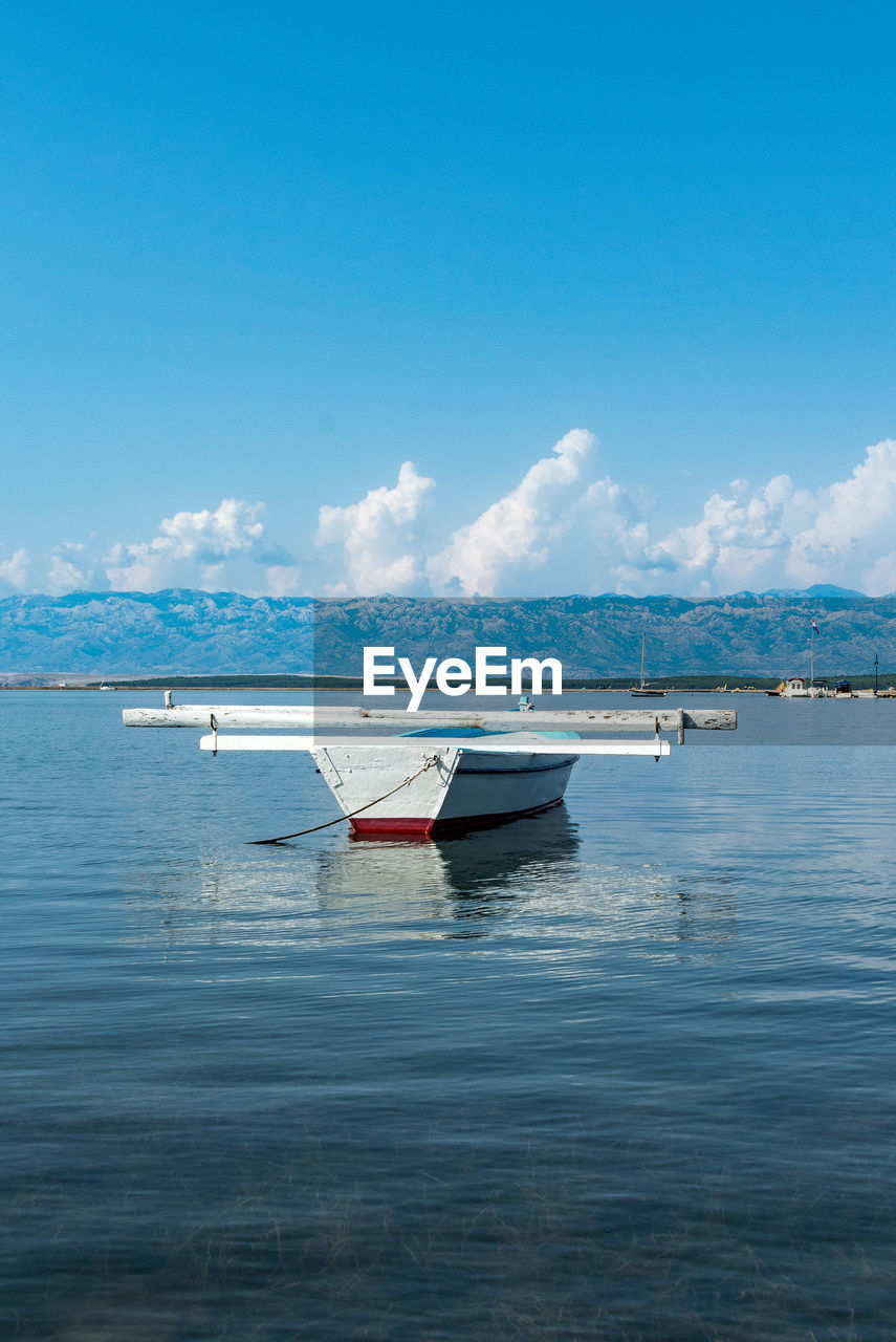 Boat in sea against sky