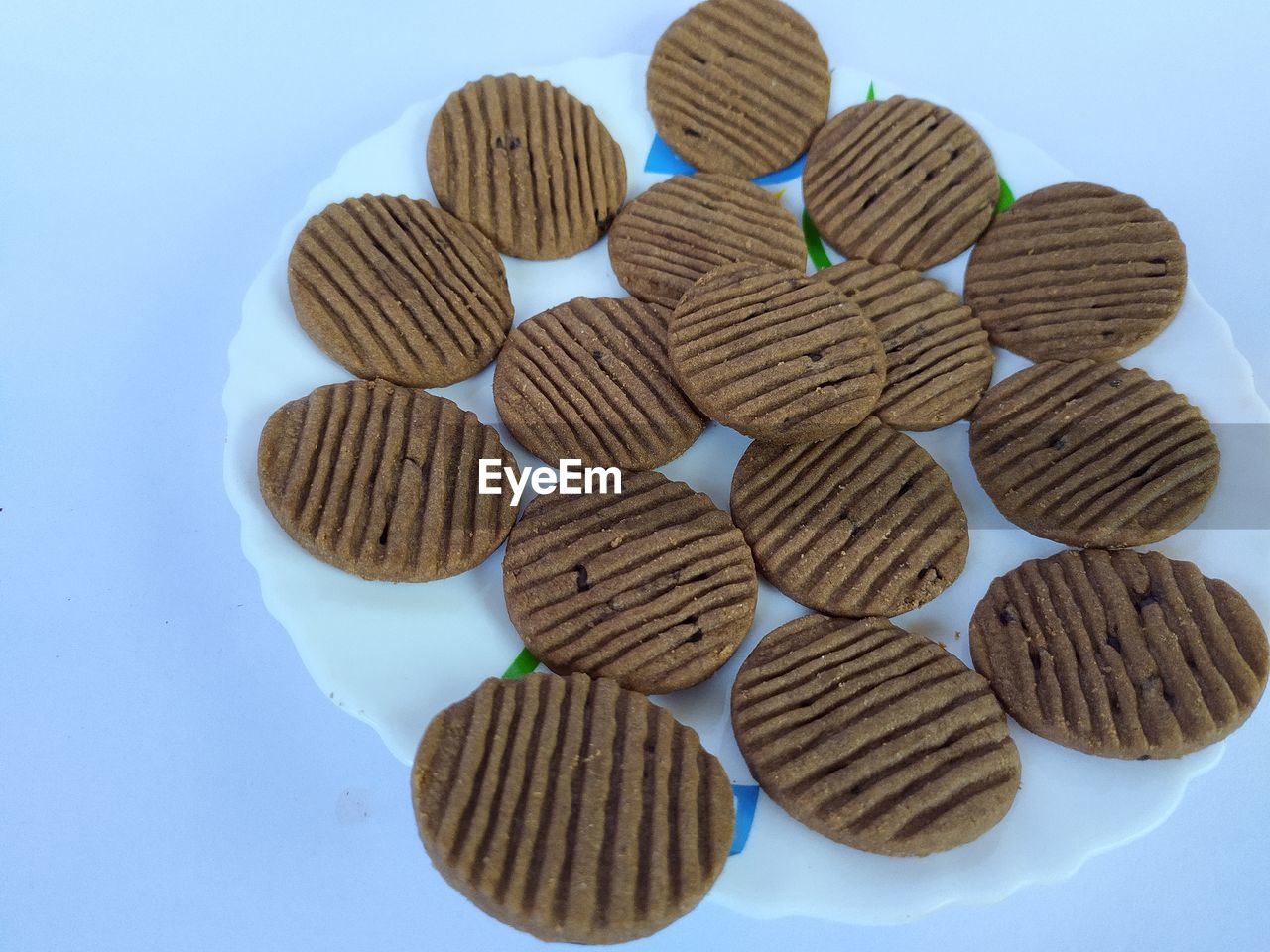 Crispy round biscuits on plate,white background.