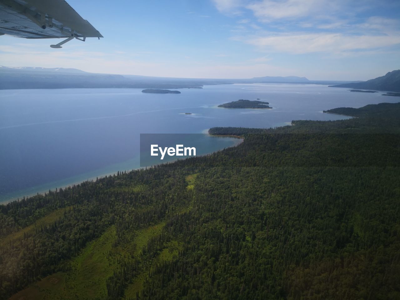 SCENIC VIEW OF SEA SEEN FROM AIRPLANE