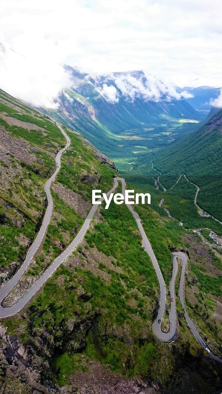 High angle view of road amidst mountains against sky