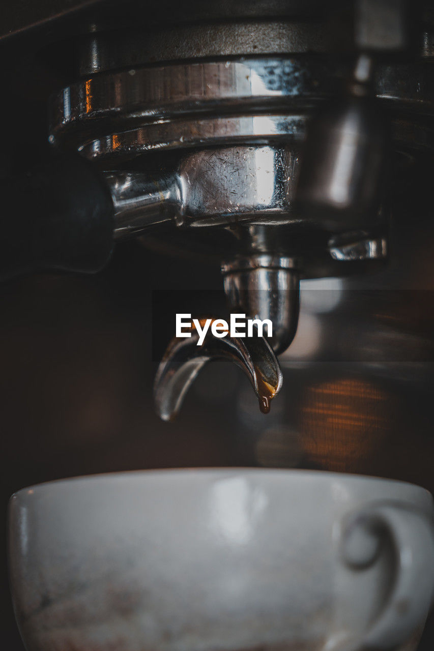 espresso machine, coffee, food and drink, drink, indoors, coffeemaker, espresso maker, refreshment, close-up, cup, mug, coffee cup, household equipment, no people, domestic room, hot drink, home appliance, machinery, appliance, metal, pouring, small appliance, home, water, freshness