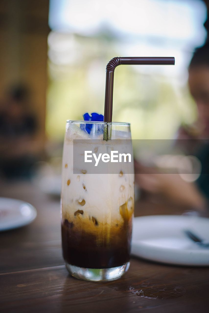 Close-up of drink in glass on table at restaurant
