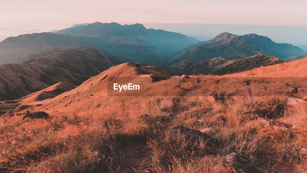 SCENIC VIEW OF ROCKY MOUNTAINS AGAINST SKY