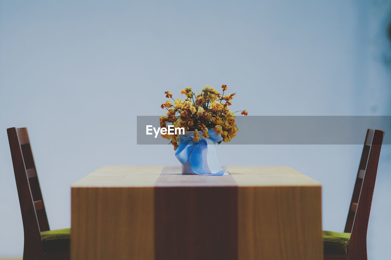 Flower vase on table