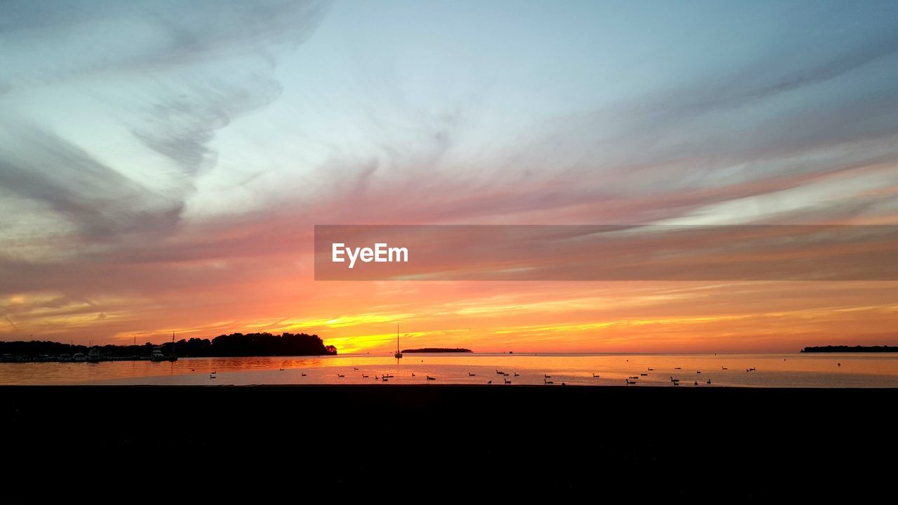 Scenic view of sea at sunset