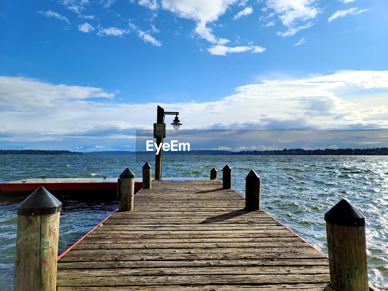 PIER ON SEA AGAINST SKY