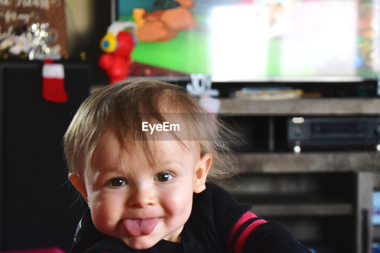 PORTRAIT OF CUTE BABY AT HOME