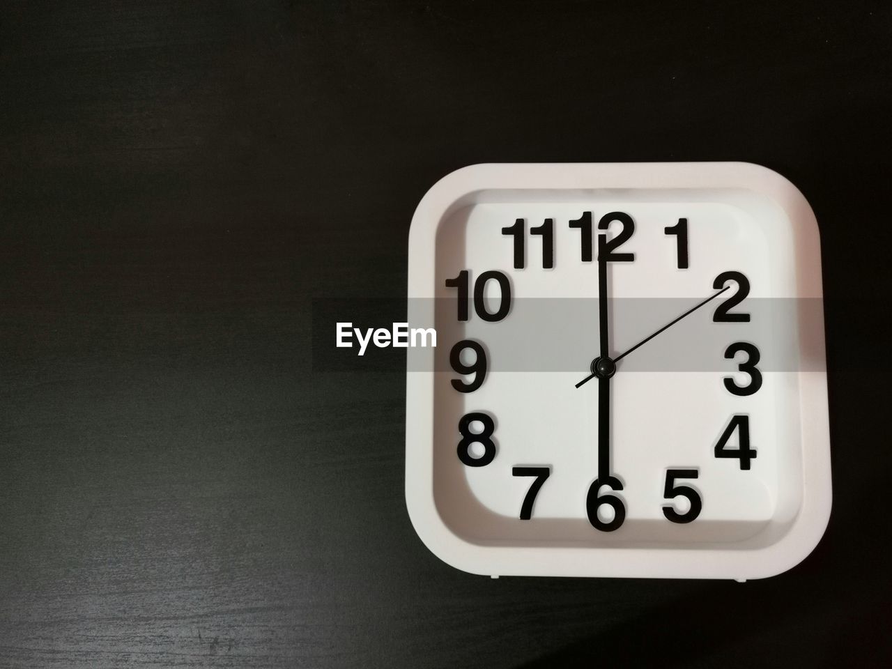 Close-up of clock on table