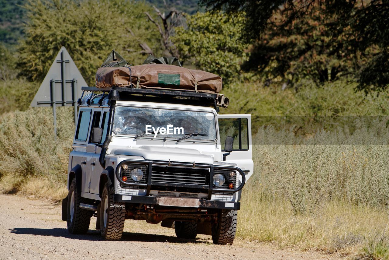 View of outdoor safari car on rough dirt road