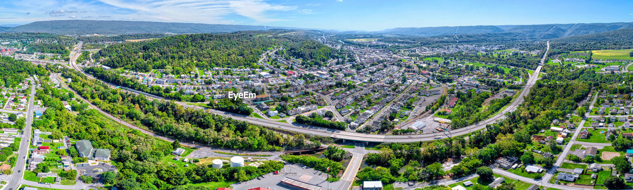 HIGH ANGLE VIEW OF TOWNSCAPE BY ROAD