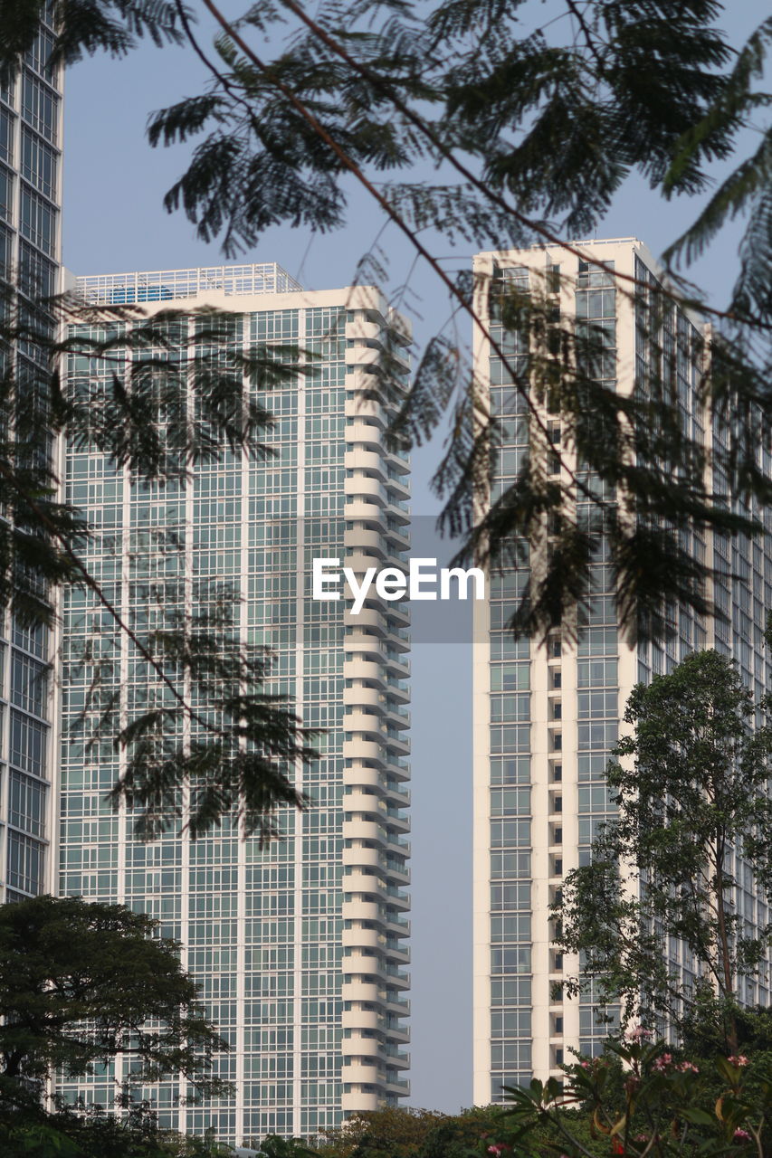 Low angle view of modern buildings against sky