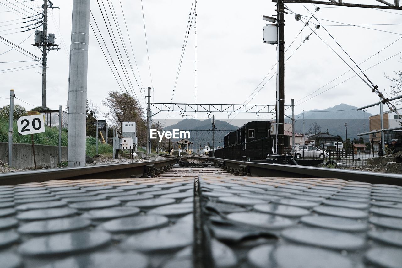 RAILROAD TRACK AGAINST SKY