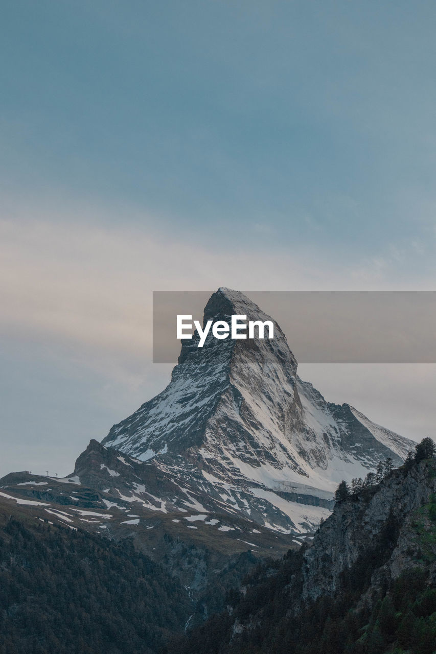 Scenic view of snowcapped mountain against sky