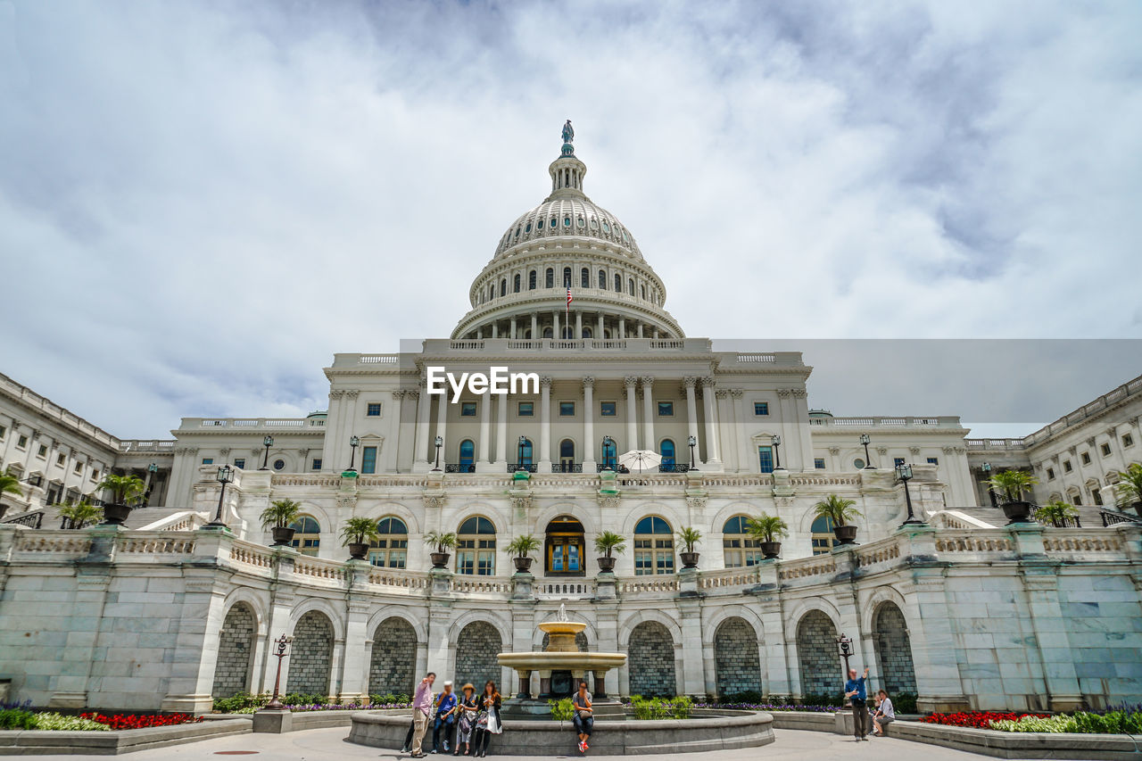 low angle view of historic building against cloudy sky