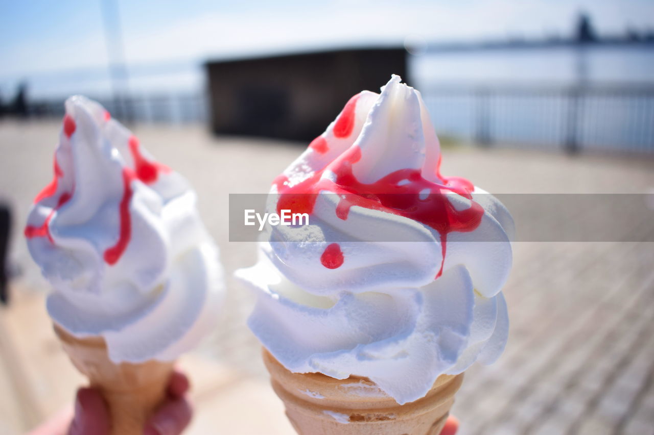 CLOSE-UP OF ICE CREAM CONE ON TABLE