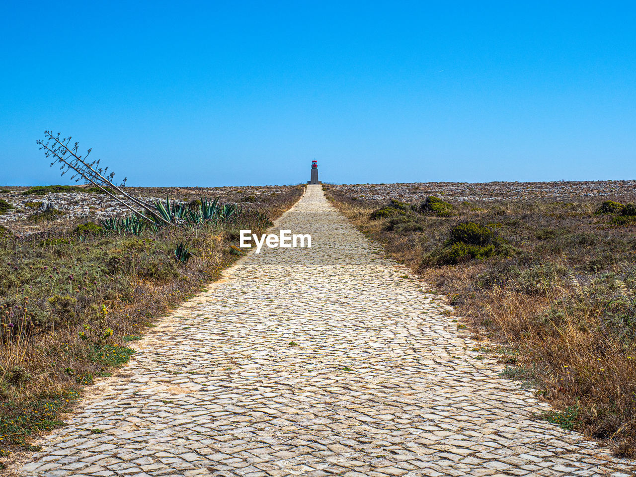 The long stone path leading to the lighthouse of ponta de sagres 