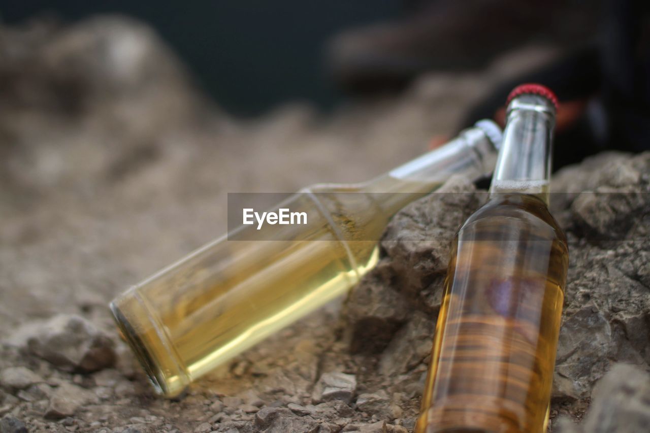 CLOSE-UP OF CIGARETTE IN GLASS