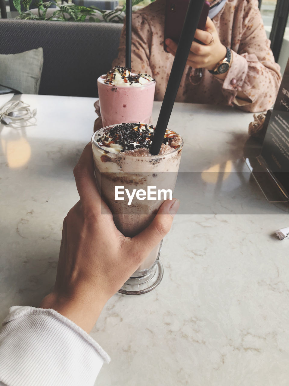 Midsection of man holding ice cream cone