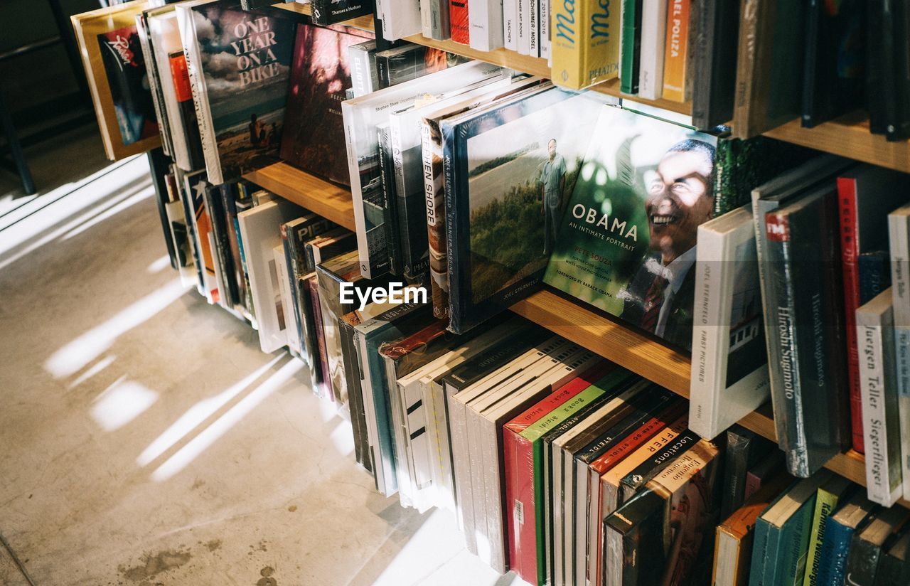 STACK OF BOOKS ON SHELF