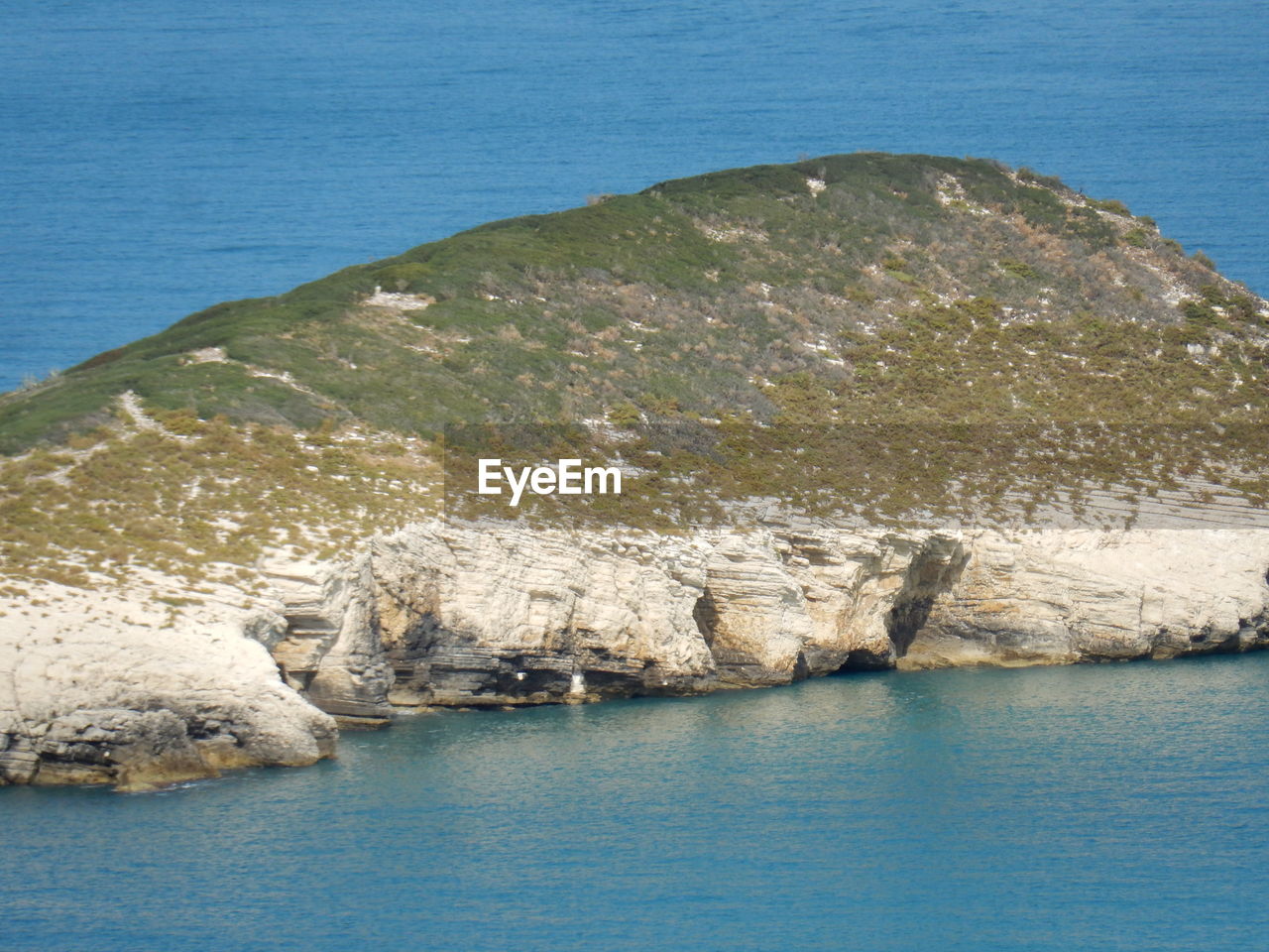 SCENIC VIEW OF SEA AND ROCK FORMATION