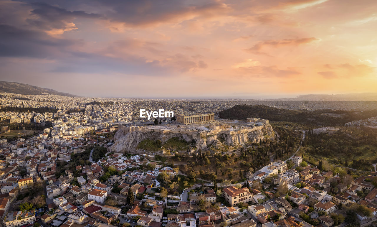 Aerial view of townscape against sky during sunset