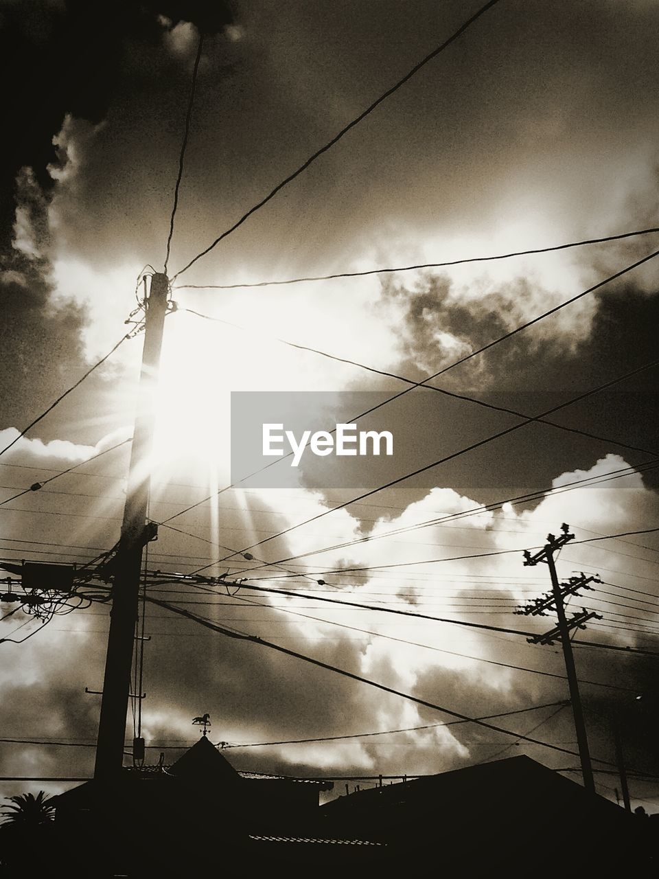 Low angle view of electricity pylon against sky