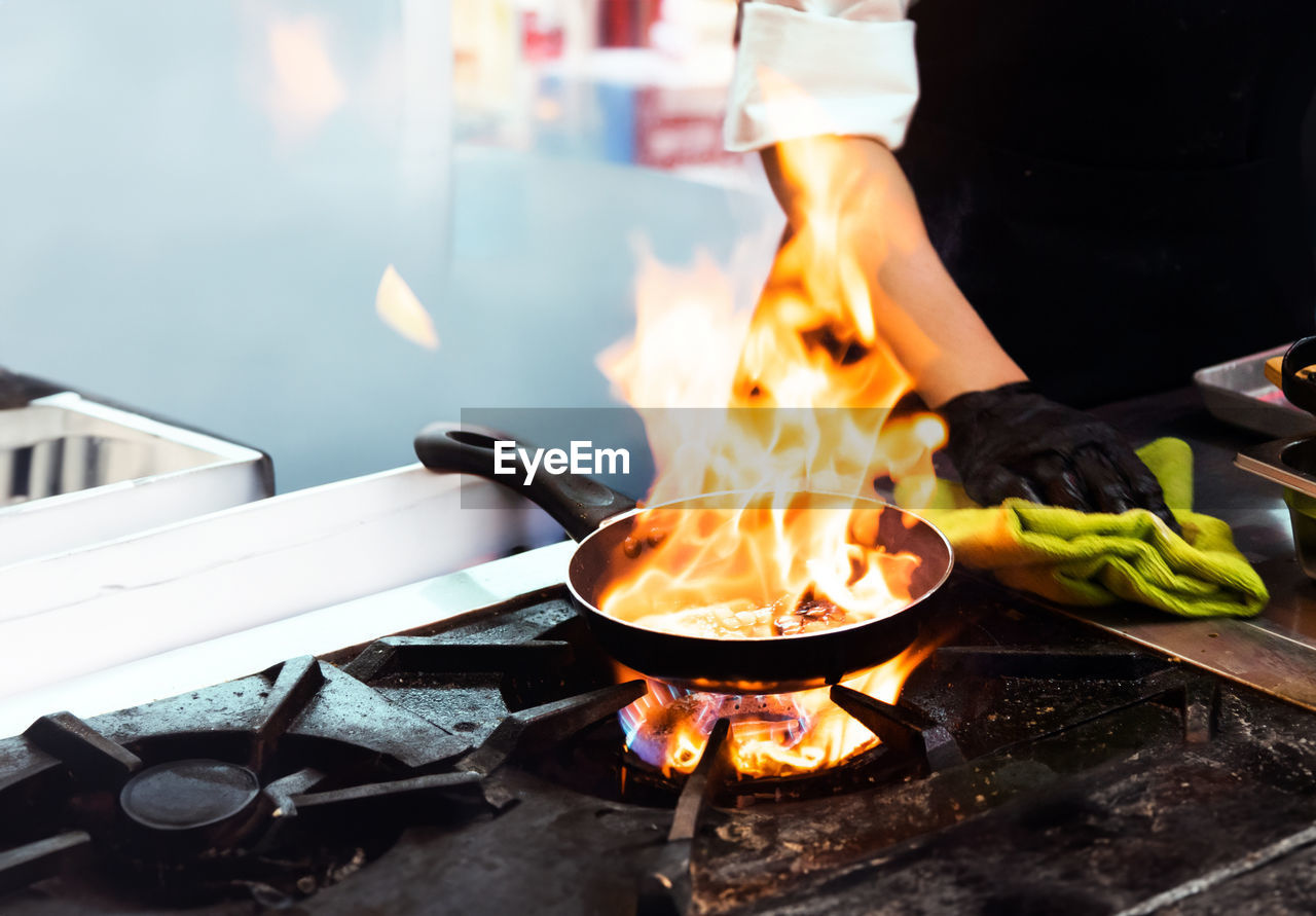 cropped image of man preparing food