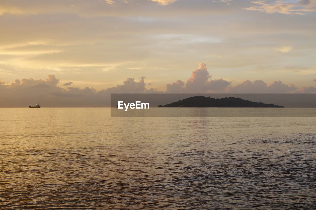 SCENIC VIEW OF SEA DURING SUNSET